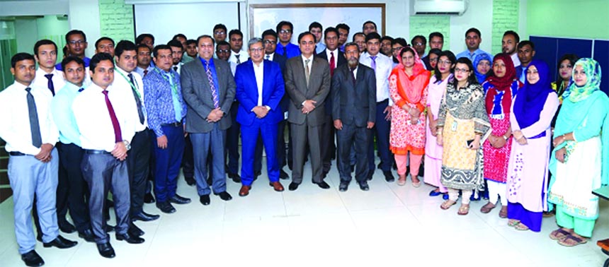 Kazi Ahsan Khalil, Managing Director (Acting) of Modhumoti Bank, poses with the participants of workshop on "Prevention of Money Laundering and Combating Financing of Terrorism (CFT) with special focus on Trade Based Money Laundering" at its Training In