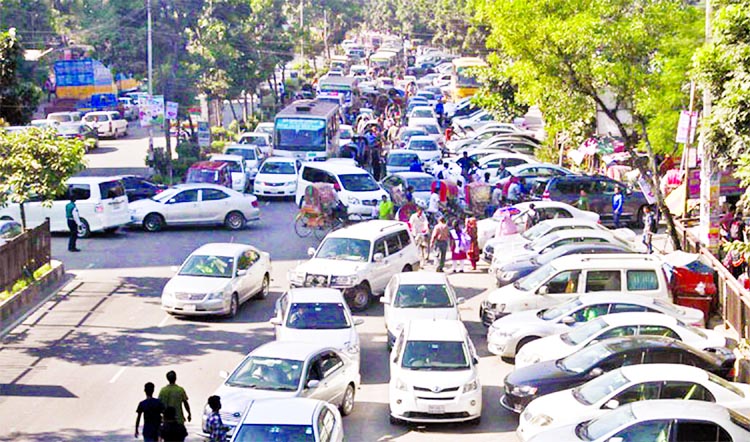 Hundreds of vehicles got stuck causing severe traffic gridlock due to illegal parking on bothsides of the main thoroughfare for several hours at Mirpur 14 Section in Ibrahimpur area on Monday.