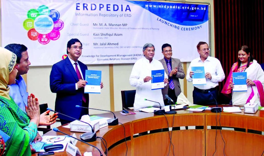 State Minister for Finance and Planning M A Mannan, unveiling the cover of ERDPEDIA User's Manual at Economic Relations Division (ERD) in the city on Monday. Jalal Ahmed, Additional Secretary (UN Wing) and Kazi Shofiqul Azam, Secretary of ERD among other