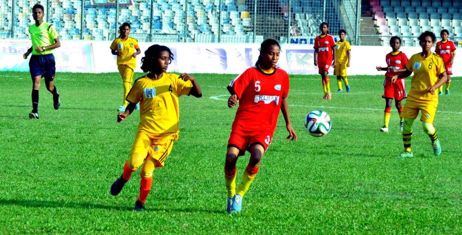 A scene from the JFA Cup U-14 National Women's Football Championship match between Thakurgaon district and Tangail district team at Bangabandhu National Stadium on Wednesday.