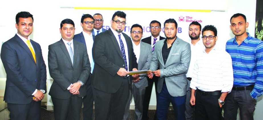 M. Nazeem A. Choudhury, Head of Consumer Banking of Eastern Bank Limited and Tareq Ibrahim, Managing Director, Savvy Foods Ltd as well as Director, Sajeeb Group exchanging documents after signing a customer benefit agreement in Dhaka. Under the agreement
