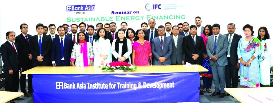 Humaira Azam, Deputy Managing Director and Chief Risk Officer (CRO) of Bank Asia Ltd, poses with the participants of a day-long seminar on "Sustainable Energy Financing" jointly organized by Bank Asia and International Finance Corporation ( IFC)- World