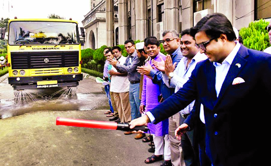 Mayor of Dhaka South City Corporation (DSCC) Sayeed Khokon inaugurating activities of water sprinkling vehicles to clean city. The snap was taken from Nagar Bhaban on Thursday.