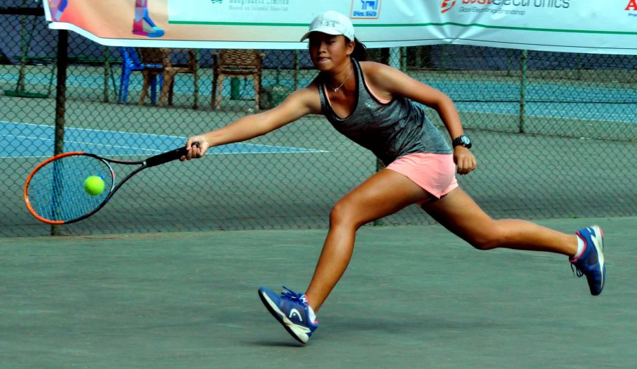 Wanyi Zhang of China in action in the Girlsâ€™ singles of International Junior Tennis Championship at the Ramna National Tennis Complex on Thursday.