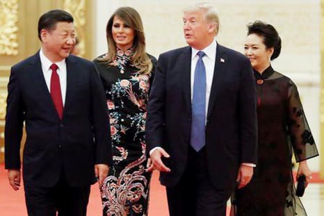 U.S. President Donald Trump and first lady Melania arrive for the state dinner with China's President Xi Jinping and China's first lady Peng Liyuan at the Great Hall of the People in Beijing.