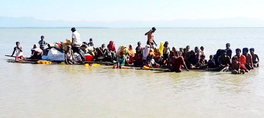 Rohingyas crossing Naf River by Bhela on their way to Bangladesh. This picture was taken from Teknaf on Wednesday.