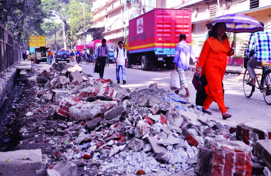 Pedestrians and also passengers facing untold sufferings for cutting road in the name of utility services. The snap was taken from the city's Tejgaon Industrial Area on Friday.