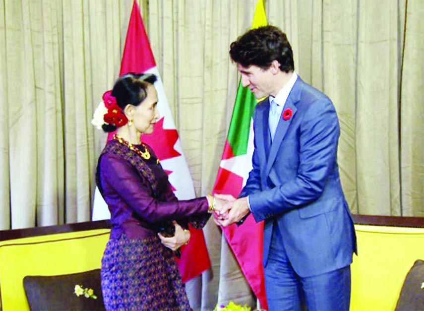 Myanmar's leader Aung San Suu Kyi greets Canadian Prime Minister Justin Trudeau in Da Nang, Vietnam, where leaders have gathered for the start of the Asia-Pacific Economic Cooperation summit.