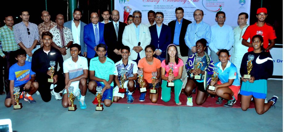 The winners of the 31st Bangladesh ITF Junior Tennis Championship with the guests and officials pose for a photo session at the National Tennis Complex in the city's Ramna on Saturday.