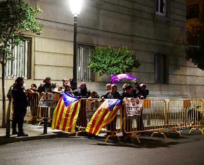 Protesters blocked roads and train lines across Catalonia on Wednesday, provoking commuter anger in a strike called by a pro-independence union over the arrests.