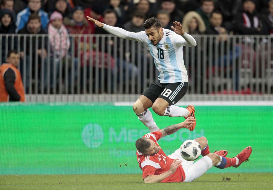 Argentina's Eduardo Salvio, top, challenges Russia's Fedor Kudryashov during their international friendly soccer match between Russia and Argentina at Luzhniki stadium in Moscow, Russia on Saturday.