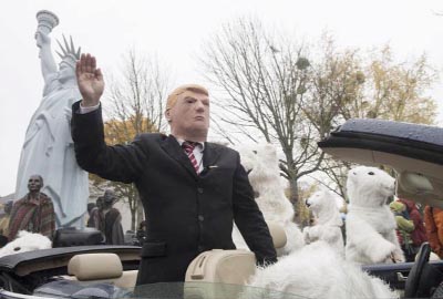 Demonstrators costumed as US President Donald Trump and polar bears protest against the climate change during climate conference COP in Bonn, western Germany on Saturday.