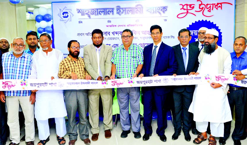 Khandaker Sakib Ahmed, Vice-Chairman of Shahjalal Islami Bank Limited, inaugurating its 107th branch at Joypurhat on Monday. M. Akhter Hossain, DMD, Md. Shamsuddoha, Head of Public Relations Division of the bank and Abdul Hakim Mondol, President of Joypur