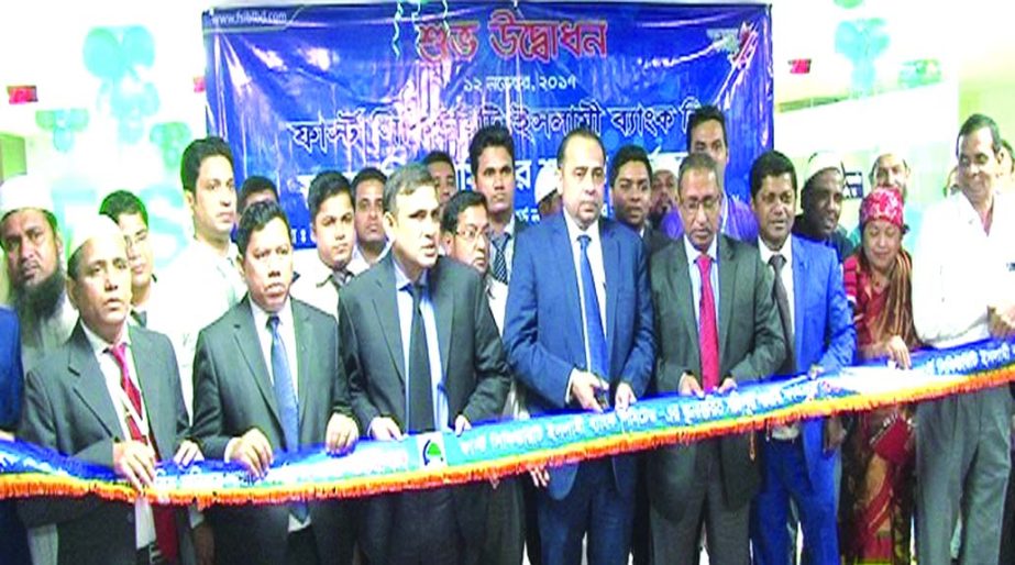 Syed Habib Hasnat, AMD of First Security Islami Bank Limited, inaugurating its relocated Shafipur branch at KZ Tower, Shafipur Bazar of Kaliakoir in Gazipur on Sunday. SM Nazrul Islam, Head of General Services Division and Shahazada Basunia, Head of Publi