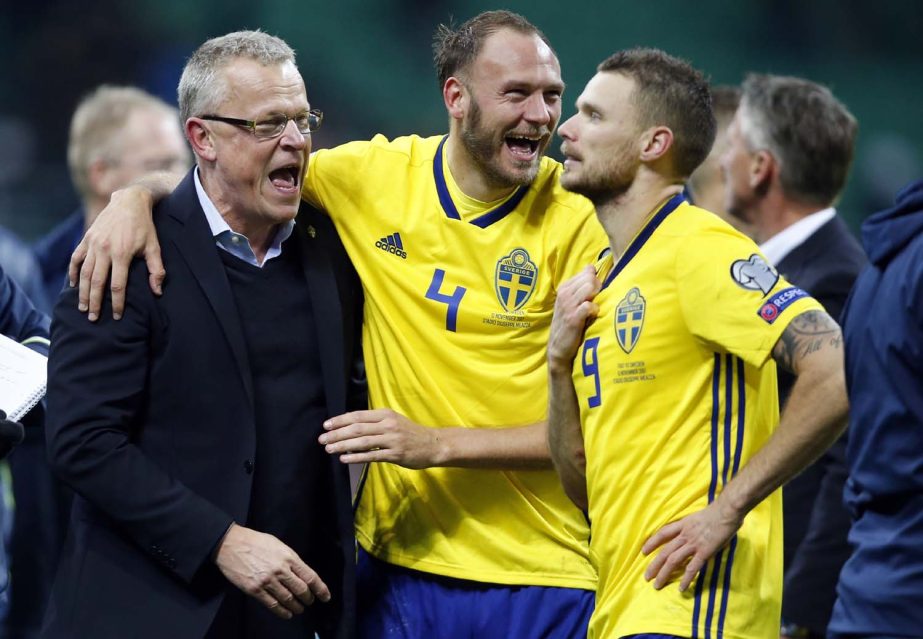 Sweden coach Janne Andersson celebrates with Andreas Granqvist and Marcus Berg, (right) at the end of the World Cup qualifying play-off second leg soccer match between Italy and Sweden at the Milan San Siro stadium, Italy on Monday.