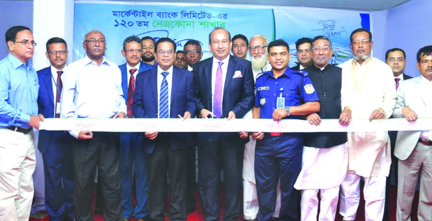 AKM Shaheed Reza, Chairman of Mercantile Bank Limited, inaugurating its 120th branch at Moktarpara Sarak in Netorkona Sadar on Tuesday. Kazi Masihur Rahman, Managing Director of the bank, Abdul Wahed, President of Netrokona Chamber of Commerce and Industr