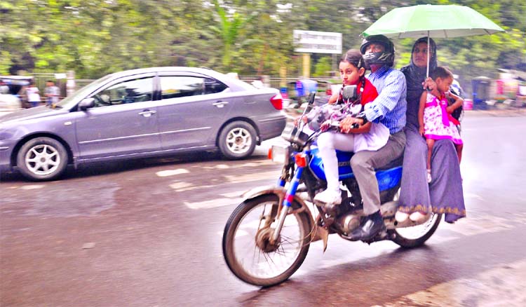 WHEN IT IS RAINING! Long ago, the Dhaka Metropolitan Police banned pillion riding on the motorcycle, but it is a common scenario in the city roads where three to four persons or a full family often travel boarding a single motorbike even without wearing a