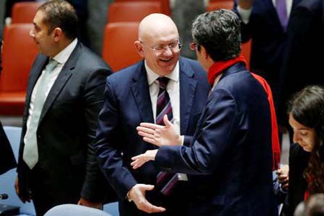 Russian Ambassador to the UN Vasily Nebenzya speaks with Permanent Representative of France to the UN Francois Delattre before a meeting of the UN Security Council to vote on a bid to renew an international inquiry into chemical weapons attacks in Syria d