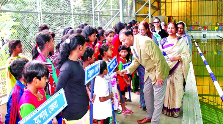 Secretary of Youth and Sports of Bangladesh Awami League Harunur Rashid being introduced with the participants of the Inter-District Women's Age Group Swimming Competition at the Sultana Kamal Women's Sports Complex in the city's Dhanmondi on Friday.