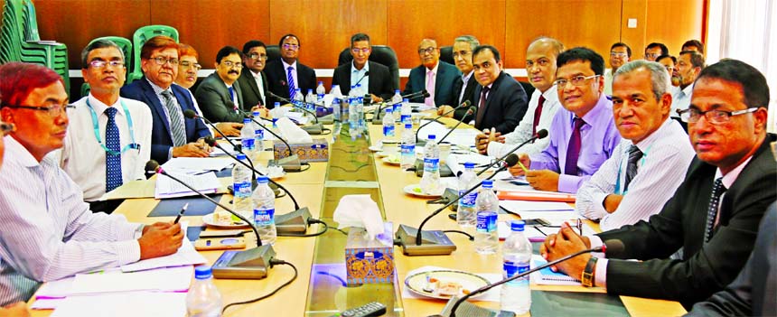 Md Abdus Salam Azad, CEO (CC) of Janata Bank Limited, presiding over the Task Force Meeting at its head office in the city on Sunday. Md. Helal Uddin and Md. Ismail Hossain, DMDs of the bank among others were also present.