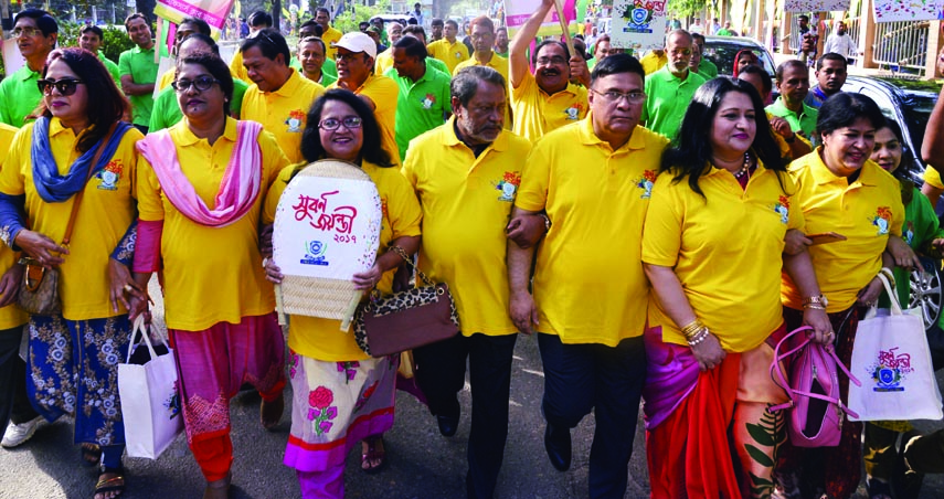 Members of Officers' Club, Dhaka brought out a rally in the city on Saturday marking the golden jubilee of the club.