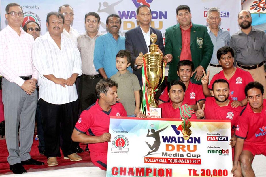 Members of Radio Today, the champions of the Walton-DRU Media Cup Volleyball with the guests and officials of Dhaka Reporters Unity (DRU) pose for a photo session at Dhaka Volleyball Stadium on Saturday.