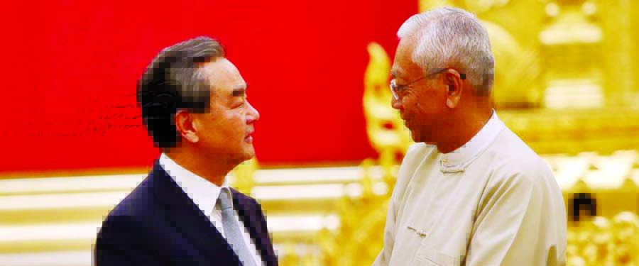 Myanmar's President Htin Kyaw, right, speaks with Chinese Foreign Minister Wang Yi during their meeting at the President House in Naypyitaw, Myanmar, Sunday.