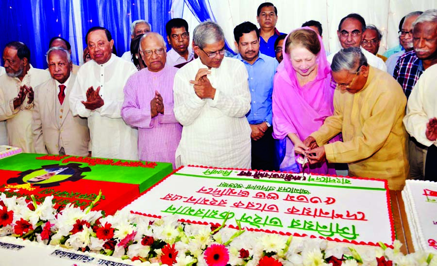 BNP Chairperson Begum Khaleda Zia cutting cake marking birthday of BNP Senior Vice-Chairman Tarique Rahman at her Gulshan office in the city on the early hours of Monday.