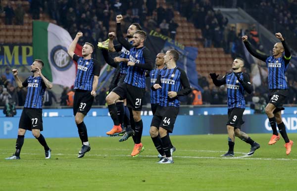 Inter Milan players celebrate they 2-0 win at the end of the Serie A soccer match between Inter Milan and Atalanta, at the Milan San Siro stadium, Italy on Sunday.