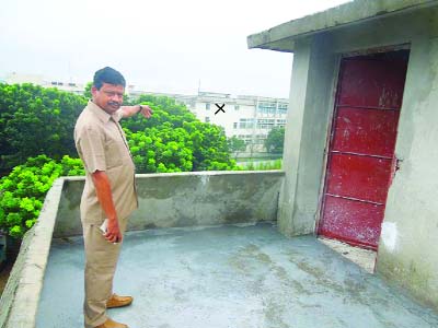 NILPHAMARI: Principal of Sonarai -Songolshi Degree College in Sadar Upazila Abdul Mazid showing building of Hong Kong- based Venchura Leather Industries (BD) Ltd at Uttara EPZ from roof of his institutes on Wednesday.