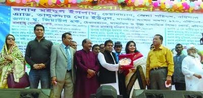 BANARIPARA(Barisal): Mahfuza Akhter, Secreray of Khalisakota High School giving a crest to the Chief Guest Talukder Md Eunus MP marking the Golden Jubilee of the School on Saturday.