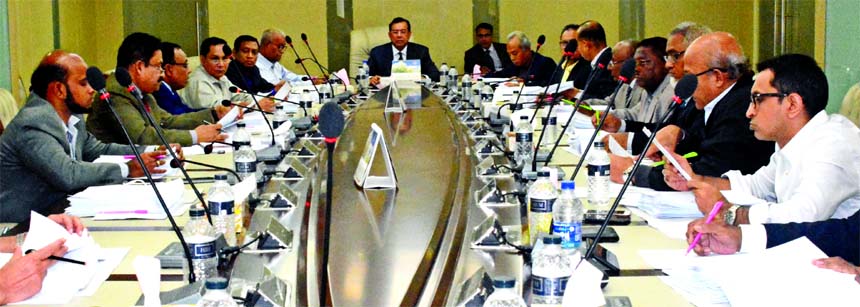 SM Amzad Hossain, Chairman, Board of Directors of South Bangla Agriculture & Commerce (SBAC) Bank Limited, presiding over its 70th meeting at the banks head office in the city on Monday. Md. Golam Faruque, Managing Director and Directors of the bank among