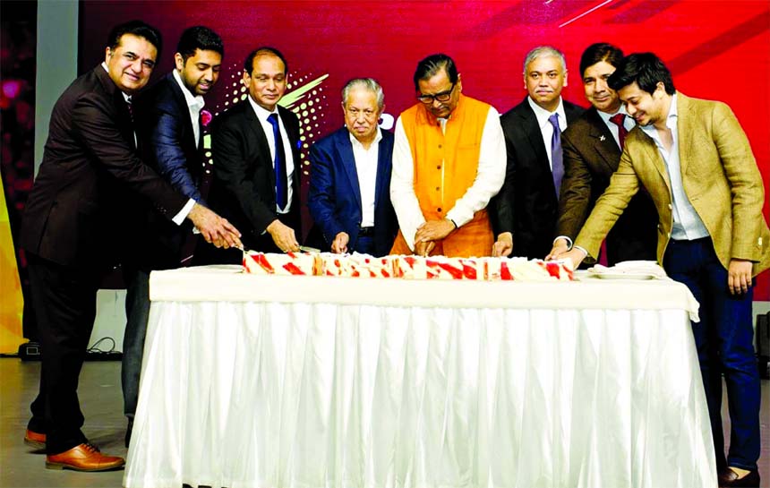 Civil Aviation and Tourism Minister Rashed Khan Menon, inaugurating the 7th anniversary of Regent Airways by cutting cake at a city hotel on Saturday. Minister for Cultural Affairs Asaduzzaman Noor MP, Yeasin Ali, Chairman, Mashruf Habib, Managing Directo