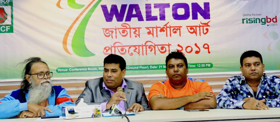 General Secretary of Bangladesh Martial Art Confederation Hasanuzzaman Moni reading the paper of Walton National Martial Art Competition at the conference room of National Sports Council on Tuesday.