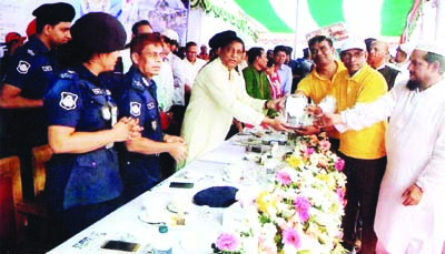CHANDPUR: Minister for Disaster Management and Relief Mofazzal Hossain Chowdhury Maya Bir Bikram MP handing over crest to Lion Faruk Ahmed Titas, Senior Vice President , Matlab Uttar Upazila Community Policing as Chief Guest for his outstanding contri