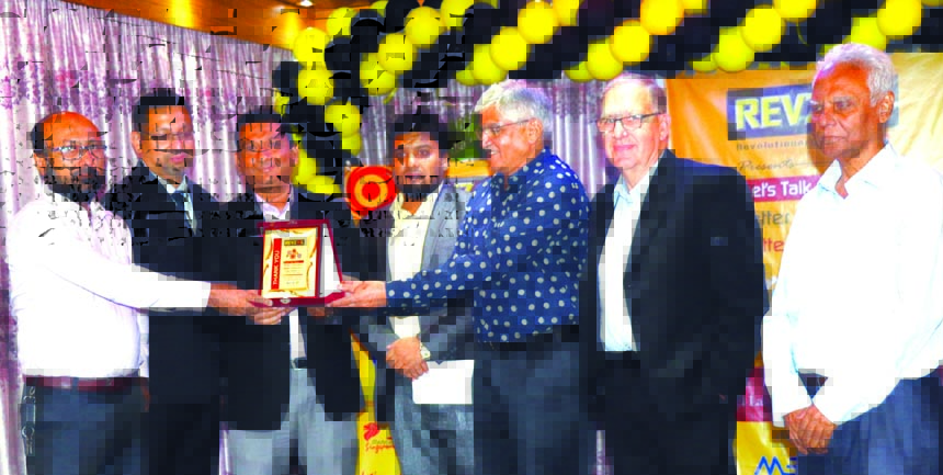 Mosaddek Hossain, CEO of MEDCO, the sole distributor for marketing and distributing of 'REVZOL', brand lubricating oil & greases in Bangladesh, receiving a crest of honour from Udey Dhir, Founder of Lubrication Institute, India and Micheal Hooper, lubri