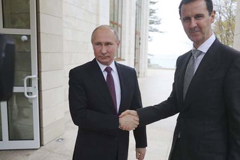 Russian President Vladimir Putin shaking hands with Syrian President Bashar al-Assad during a meeting in the Black Sea resort of Sochi, Russia on Monday.