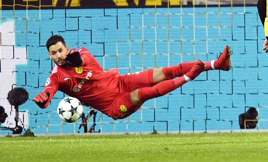 Dortmund goalkeeper Roman Buerki makes a save during the soccer Champions League group H match between Borussia Dortmund and Tottenham Hotspur in Dortmund, Germany on Tuesday.