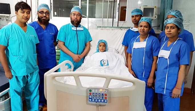 Chief Cardiac Surgeon of Chittagong Metropolitan Hospital Dr. Sarwar Kamal seen alongwith his surgery team members after undergoing new cosmetic method of heart operation of one 8 years old child Surjya Moni recently.