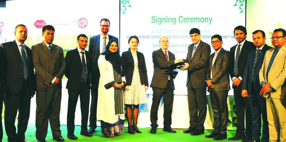 Ahsan Khan Chowdhury, Chairman and CEO of PRAN-RFL Group and Jochen Steinbuch, Regional Director of DEG (a German finance and development organization) exchanging and agreement signing documents at a city hotel on Wednesday. Under the deal, DEG will provi