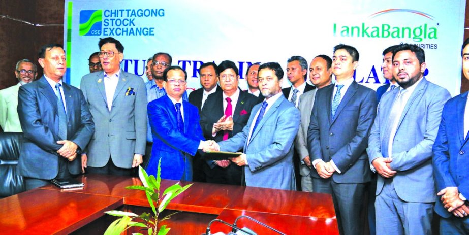 Dr. AK Abdul Momen, Chairman of Chittagong Stock Exchange (CSE) and Md. Nasir Uddin Chowdhury Managing Director of LankaBangla Securities Limited, exchanging a MoU signing documents to introduce Virtual Trading Simulator first time in the country at CSE D