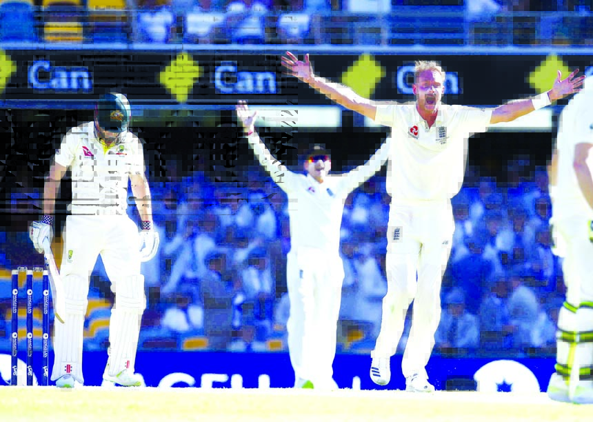 England's Stuart Broad appeals for the wicket of Australia's Shaun Marsh (left with bat in hand) during the Ashes cricket Test between England and Australia in Brisbane, Australia on Friday.