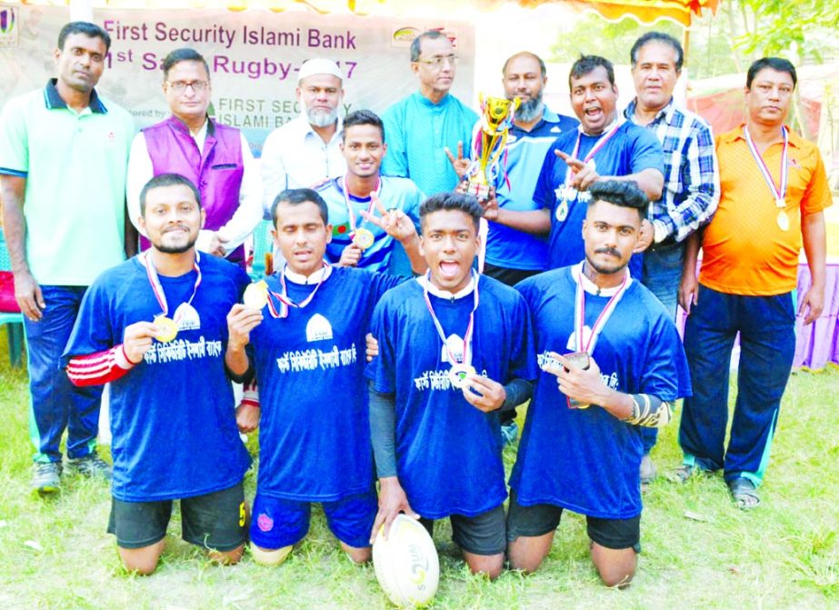 Members of Flame Boys Rugby Club, the champions of the 1st First Security Islami Bank Sand Rugby Competition with the guests and officials of Bangladesh Rugby Union pose for photograph at the Paltan Maidan on Friday.