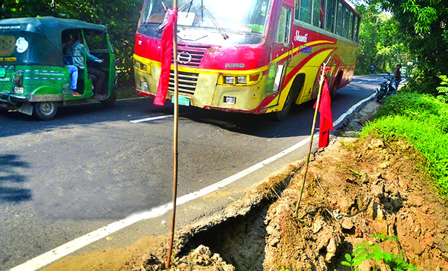 A portion of the Chittagong-Khagrachhari highway on the verge of collapse due to a ditch at Monira Pukur point of Hathazari also poses threat to smooth movement of the vehicles. This photo was taken on Saturday.