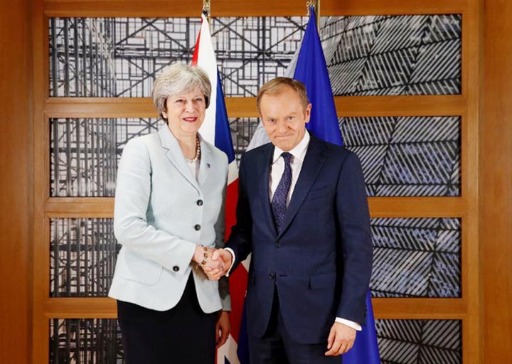 Britain's Prime Minister Theresa May and European Council President Donald Tusk attend a bilateral meeting during the Eastern Partnership summit at the European Council headquarters in Brussels on Friday.