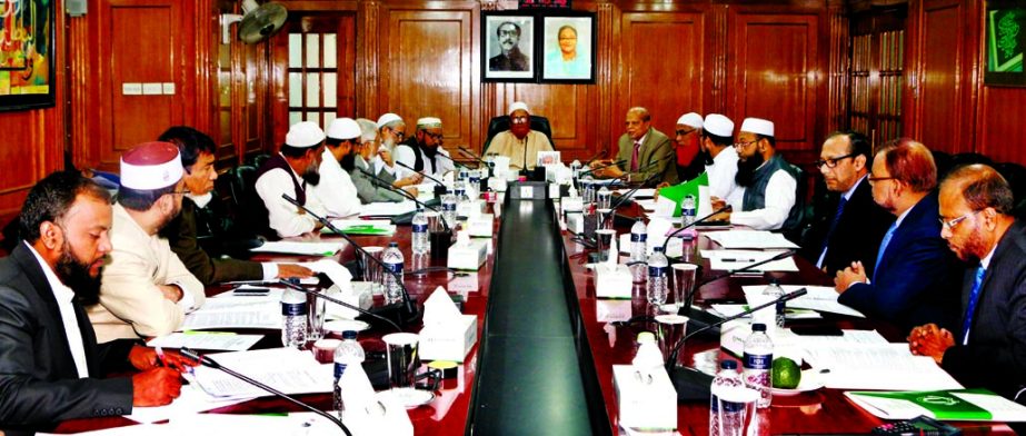 Mufti Sayeed Ahmad, Vice Chairman of Shariah Supervisory Committee of Islami Bank Bangladesh Limited, presiding over a Shariah meeting at its head office on Thursday. Dr Mohammad Abdus Samad, Member Secretary and Md Abdul Hamid Miah, Managing Director of