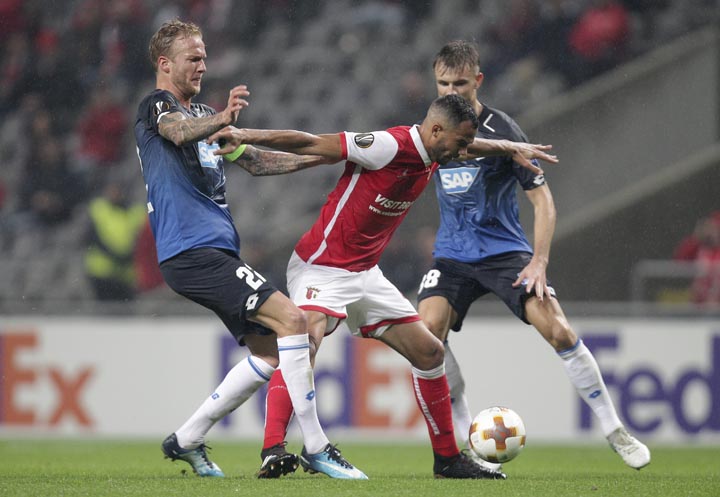 Hoffenheim's Kevin Vogt (left) fights for the ball with Braga's Fransergio during the Europa League group C soccer match between Braga and Hoffenheim at the Municipal stadium in Braga, Portugal on Thursday.