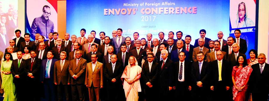 Prime Minister Sheikh Hasina at a photo session with envoys at the Envoys' Conference organised by the Foreign Ministry at a hotel in the city on Sunday. BSS photo