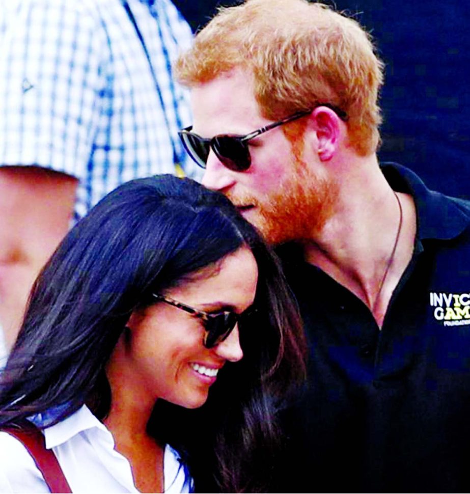 Britain's Prince Harry arrives with girlfriend Meghan Markle at the wheelchair tennis event during the Invictus Games in Toronto, Canada.