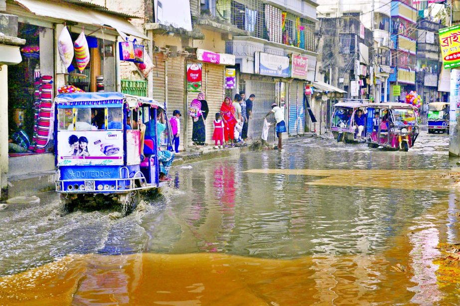 The busy road at city's Dholairpar area is being overflowed by the drain water for the last few days. But the authorities concern did not remove the stinky water yet. This photo was taken on Monday.